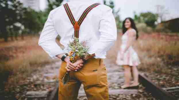 boy holding flower